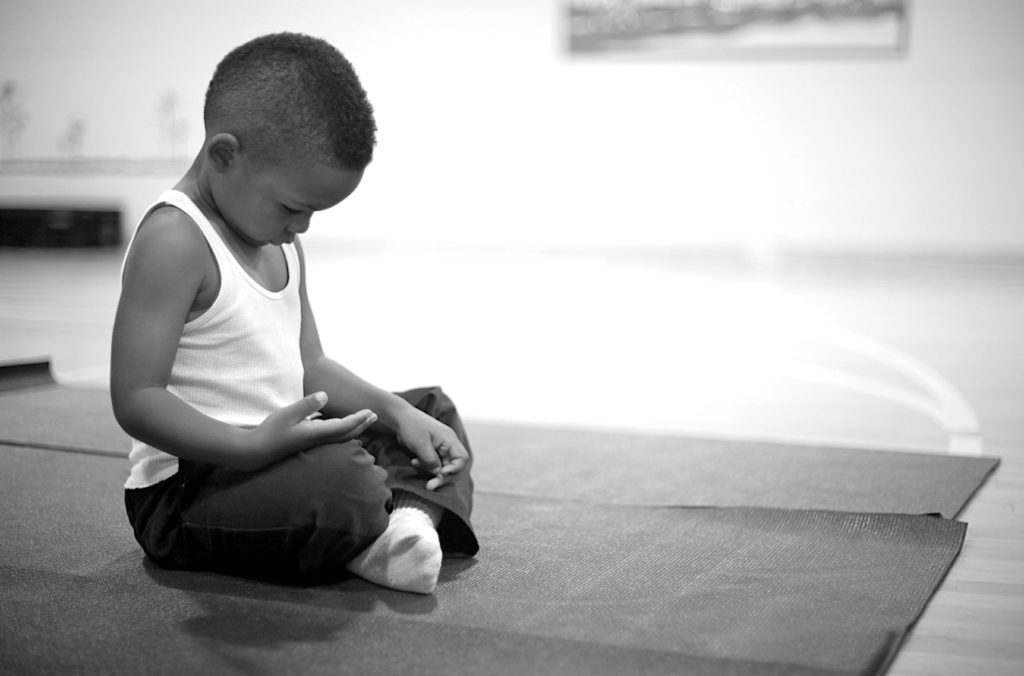 Child on yoga mat