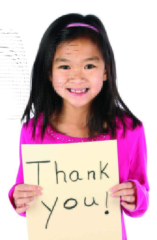 child holding Thank You