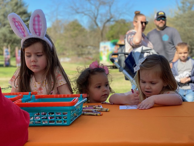 Three children draw bunnies at Bunny Bonanzoo at the Maryland Zoo in Baltimore
