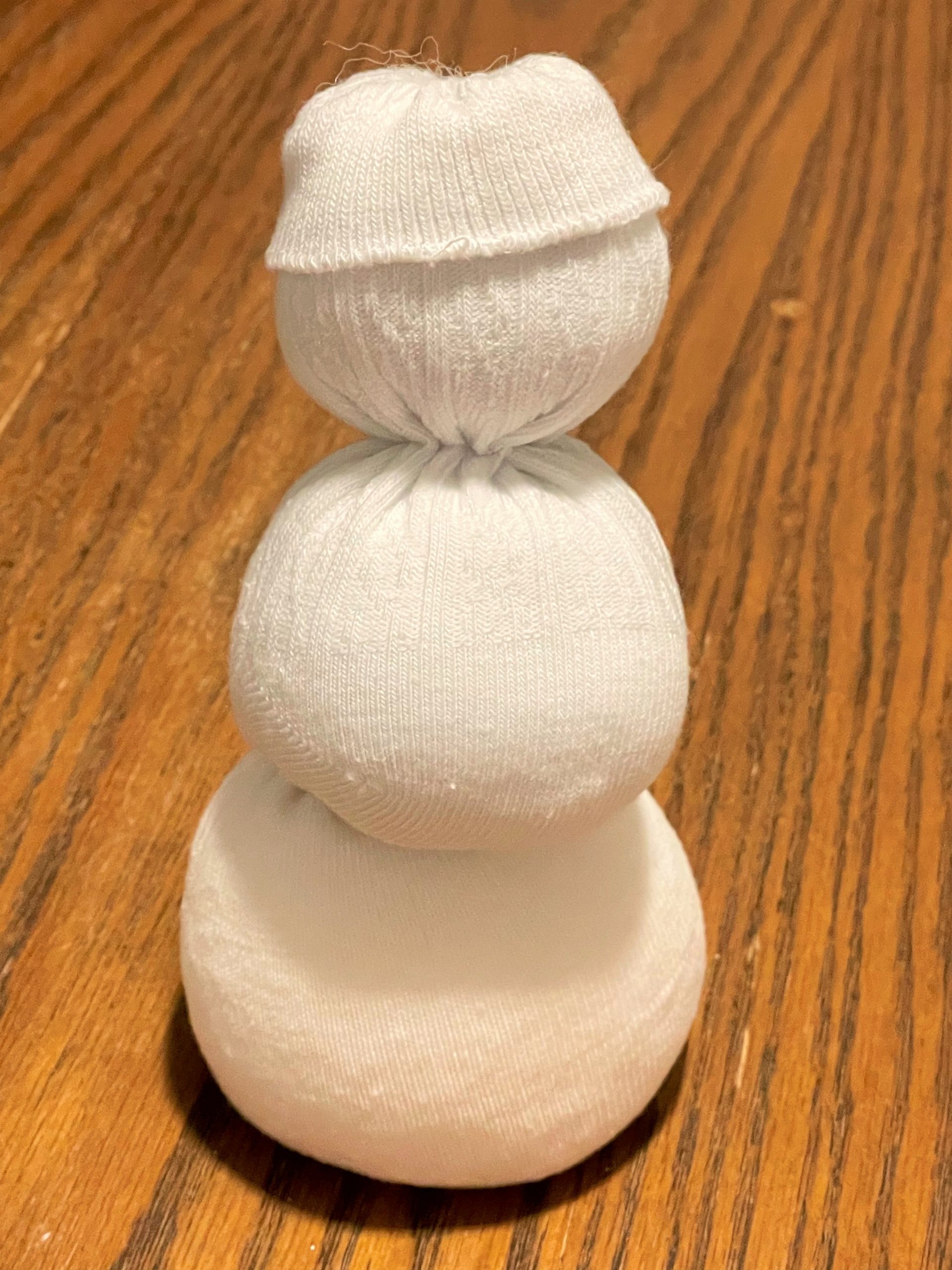 An unfinished sock snowman. 