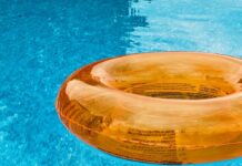 Heat Wave Safety for Families An orange floatie drifts in a pool.