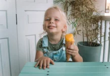 Little girl enjoying mango ice cream| Image by Roman Odintsov via Pexels