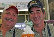 Maryland Foods Pavilion Director Farmer Stan and Assistant Wayne Armacost showing off the fresh, local peach sundae at the Maryland State Fair