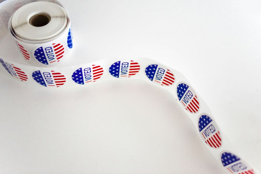 A spool of "I Voted" stickers on a white background