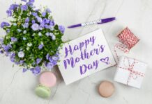 Celebrate Mom on Mother’s Day: Things to Do in the Baltimore Area Mother's Day table spread with a sign written in purple, flowers and more