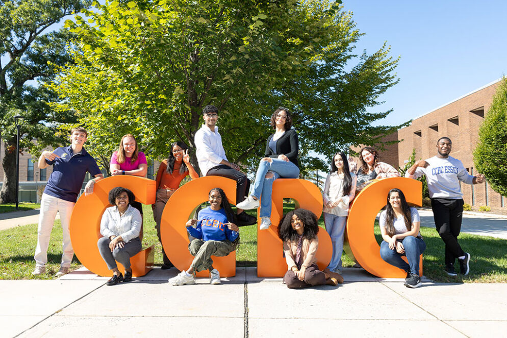 CCBC Students posing on the CCBC sign.