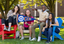 CCBC Students posing for a photo holding a CCBC banner.