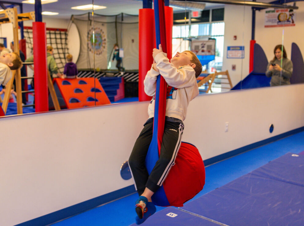 A child on a fabric swing