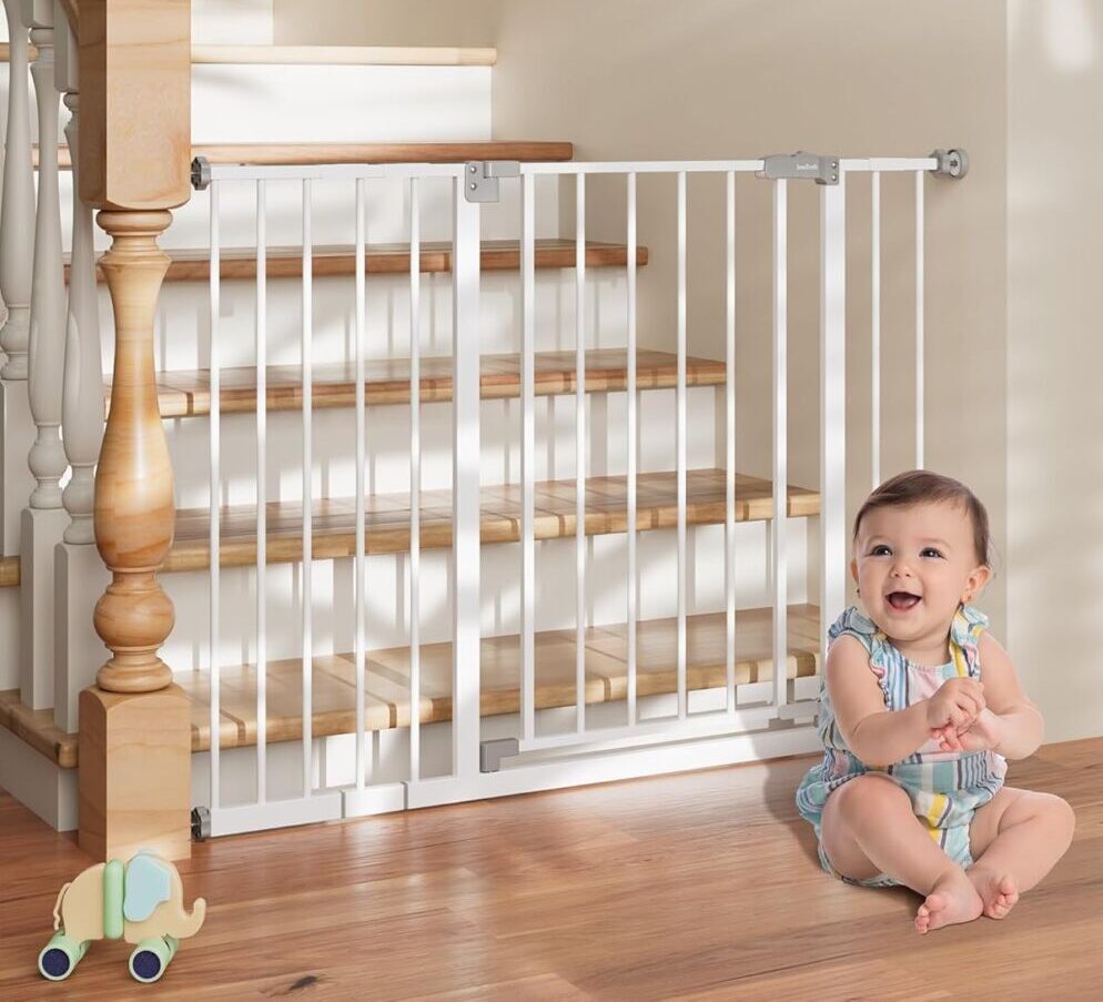 Baby next to gated-off stairs