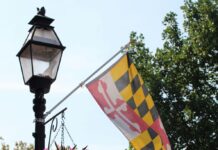 Here’s What Parents Need to Know About Maryland’s New Laws The Maryland flag hanging on a street light