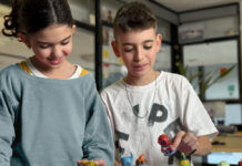 Children playing with Loops Lab figures
