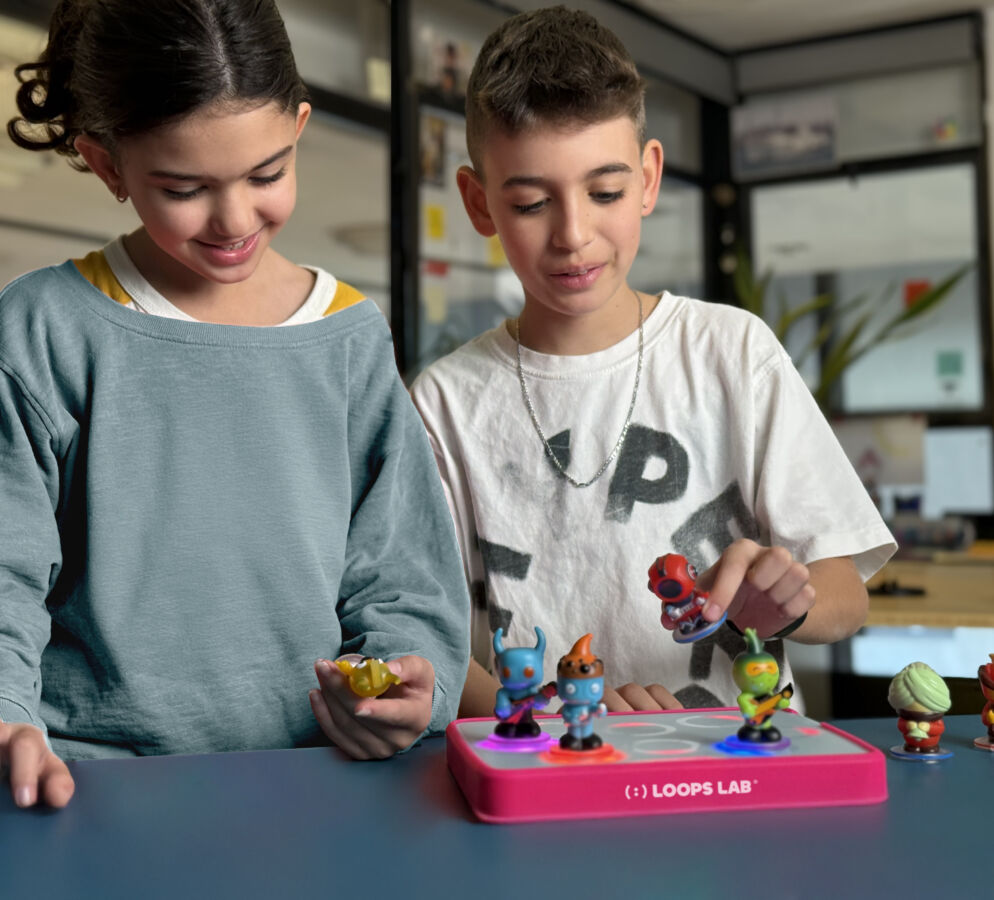 Children playing with Loops Lab figures