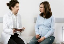A doctor speaking with a pregnant mother