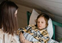 Proactive Health for Families: How To Beat Cold & Flu Season A sick child in bed