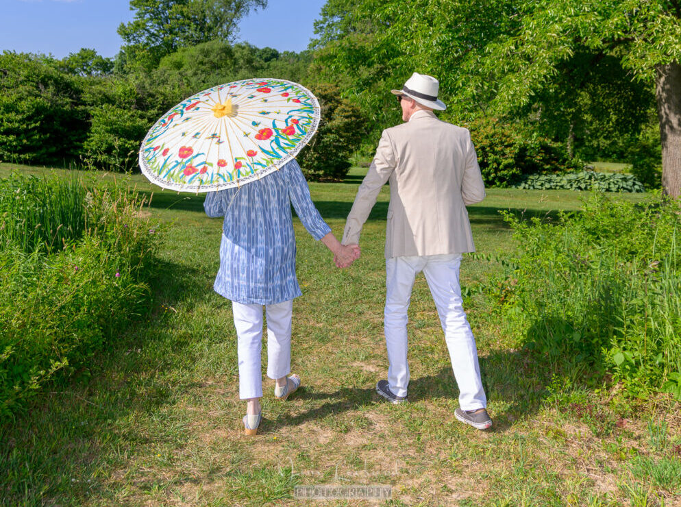 A couple walking through Ladew Gardens