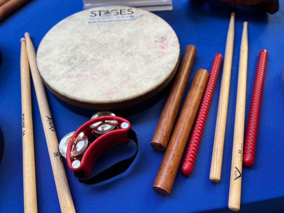 Drumsticks, a shaker and other percussion instruments on display via STAGES Music Arts at Baltimore's Child's Summer Camps & Activities Fair