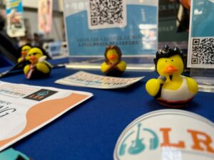 Camp fair display for Lutherville Music School with rubber ducks dressed like rock and roll artists at Baltimore's Child's camp fair