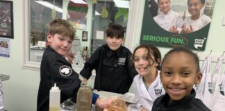 Young chefs from Young Chefs Academy in the kitchen