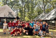 A group photo outside at Adamah Adventure Camp in Reisterstown, MD