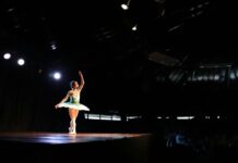 A ballet dancer alone onstage