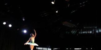A ballet dancer alone onstage