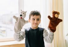 Boy with two hand puppets