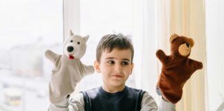 Boy with two hand puppets