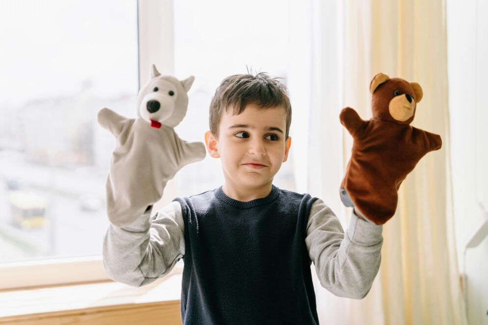 Boy with two hand puppets