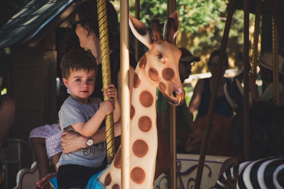 Boy riding a merry-go-round