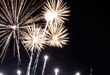 Fireworks against an American flag