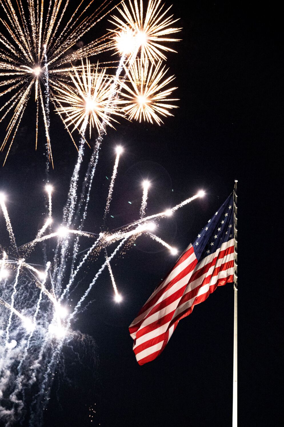 Fireworks against an American flag