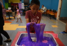 A child playing with slime