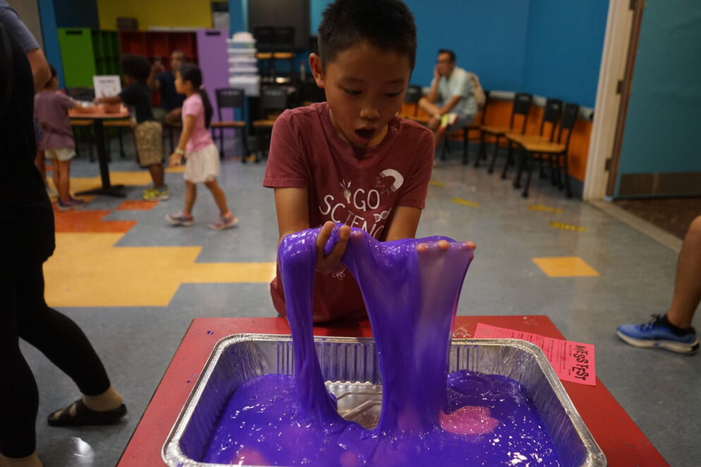 A child playing with slime