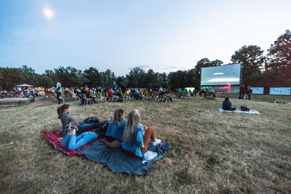 People watching a movie outside