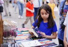 Girl looking at books