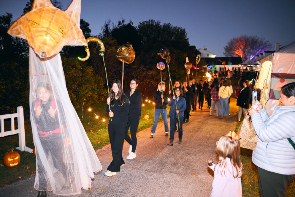 People walking in a parade at Garden Glow