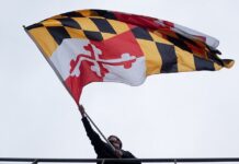 Man waving a Maryland flag