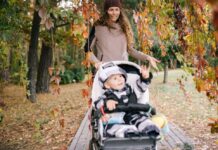 Woman walking with a baby in a stroller